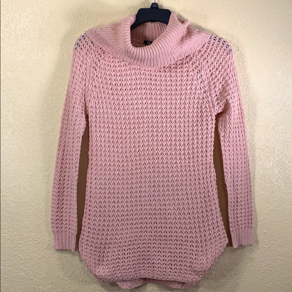 Pink cowl neck sweater.